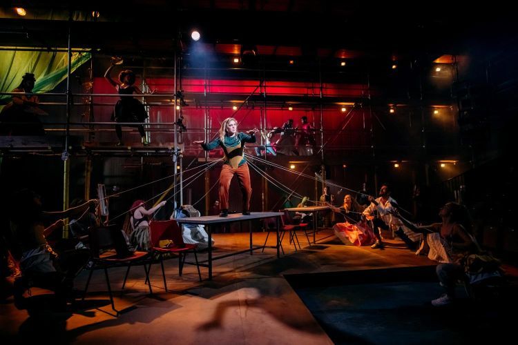 Actors dancing on the set of Provok'd, with one standing on a table